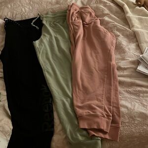 Three pairs of sweatpants joggers, one Reebok other two Ambiance